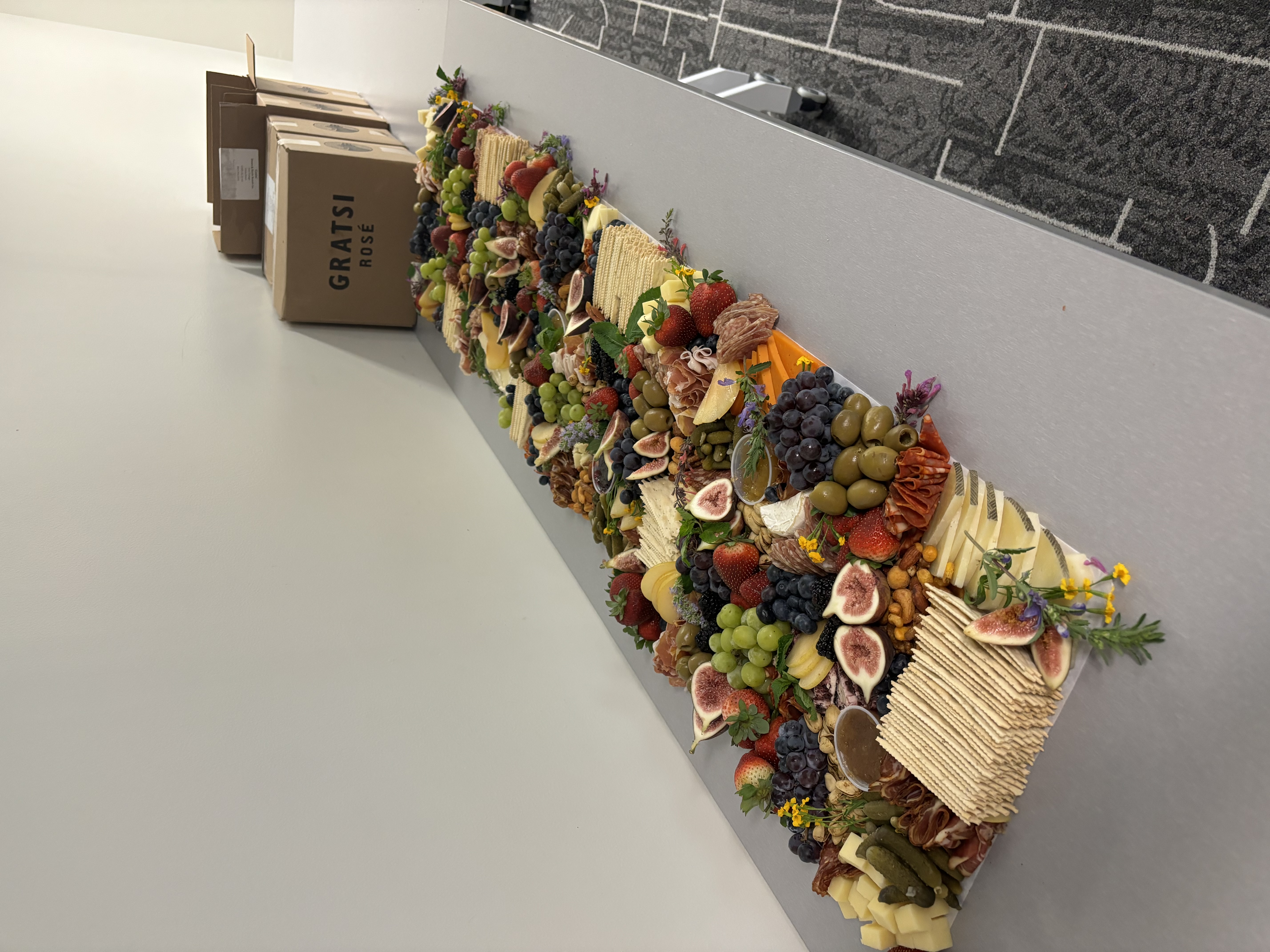 Standard charcuterie platter featuring fine meats, cheddar and gouda