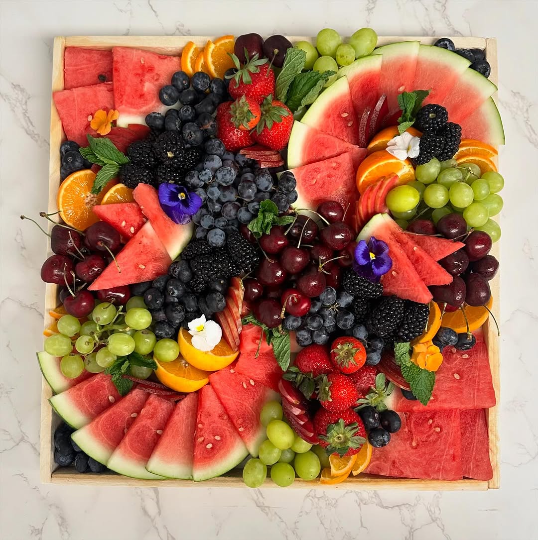 Vibrant fruits and crisp raw vegetables paired with delicious spreads